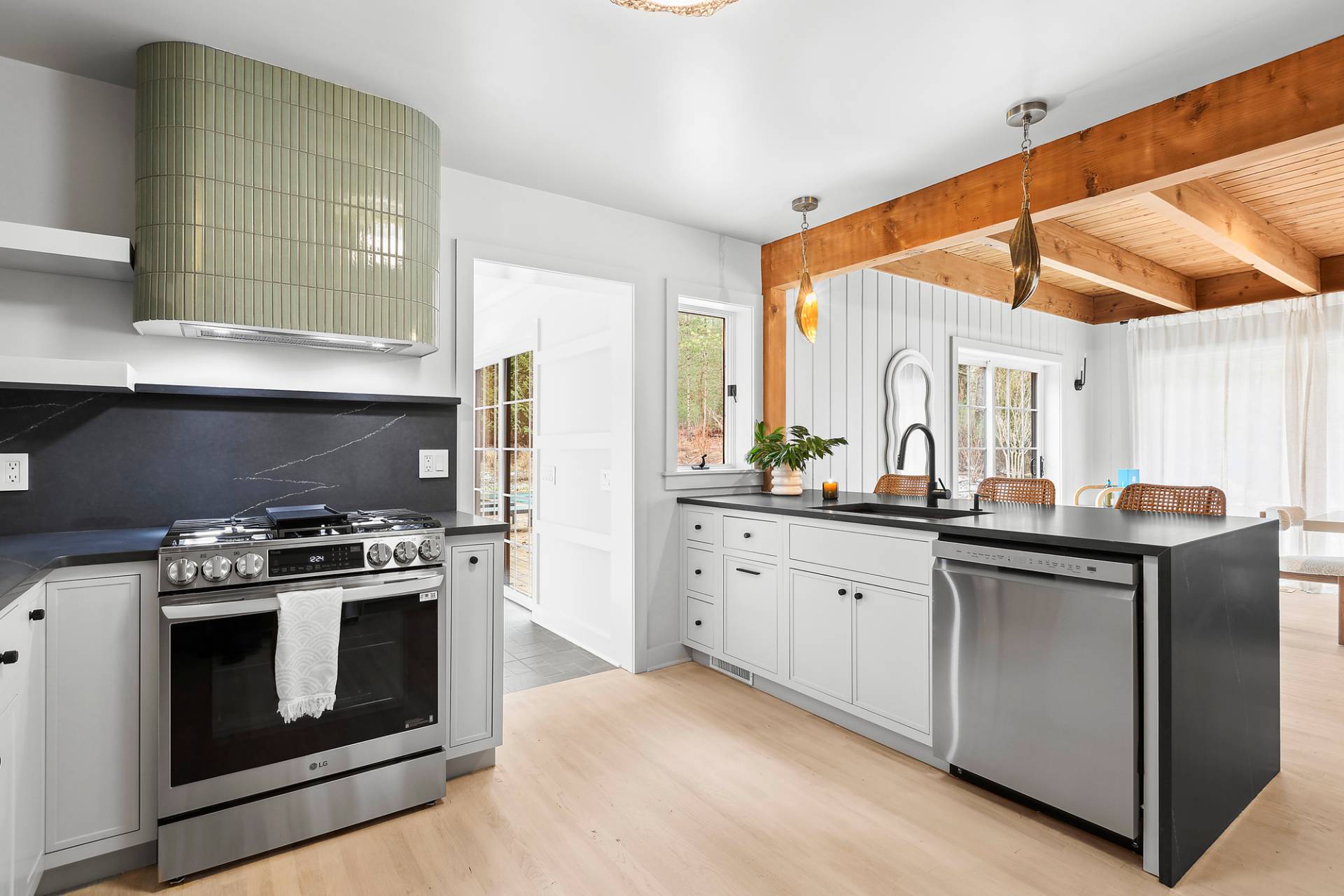 5 Phoebe Scoys Road East Hampton, NY 11937 - Photo 24 of 43 a kitchen with a stove top oven sink and cabinets