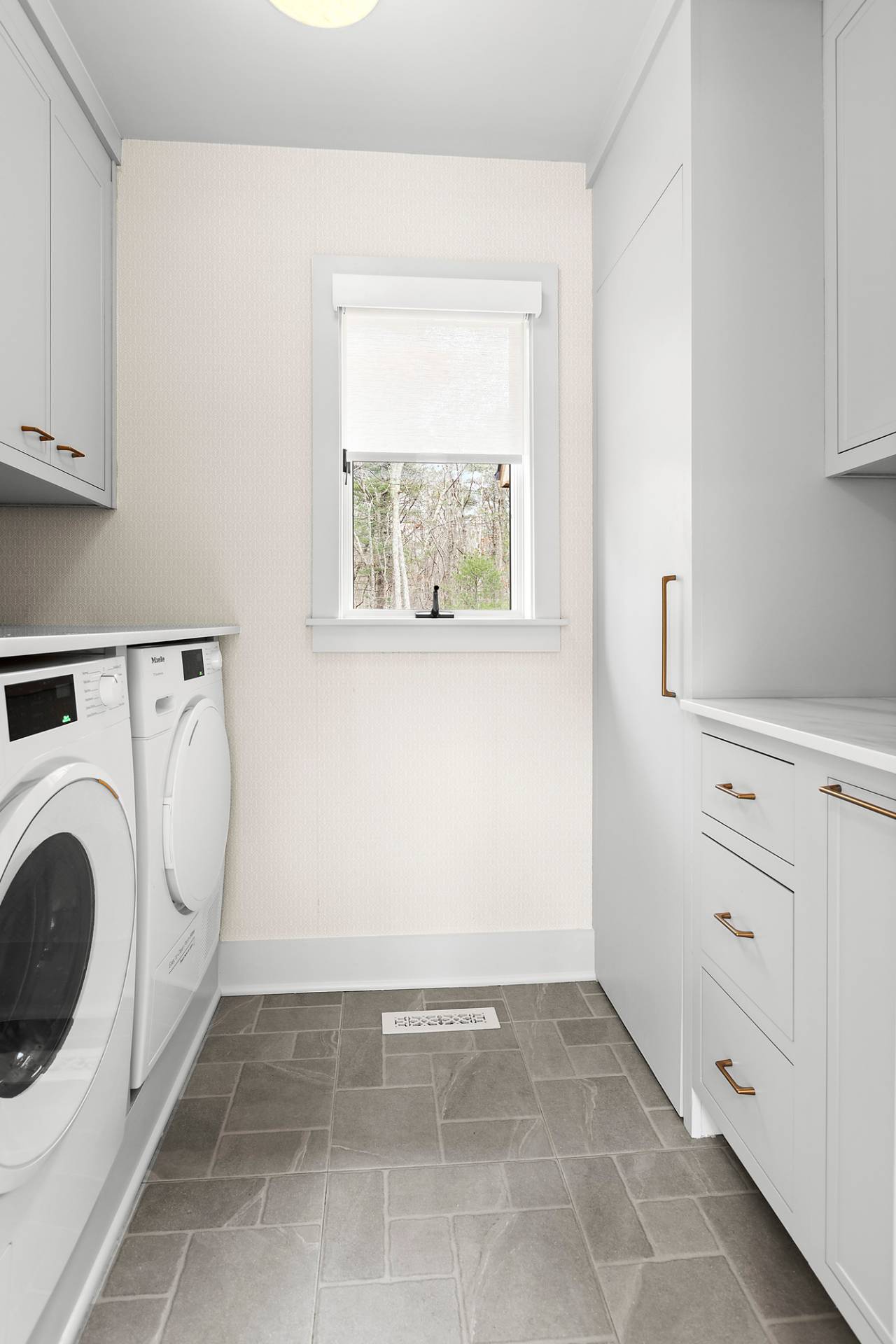 5 Phoebe Scoys Road East Hampton, NY 11937 - Photo 27 of 43 a view of a storage & utility room with washer and dryer