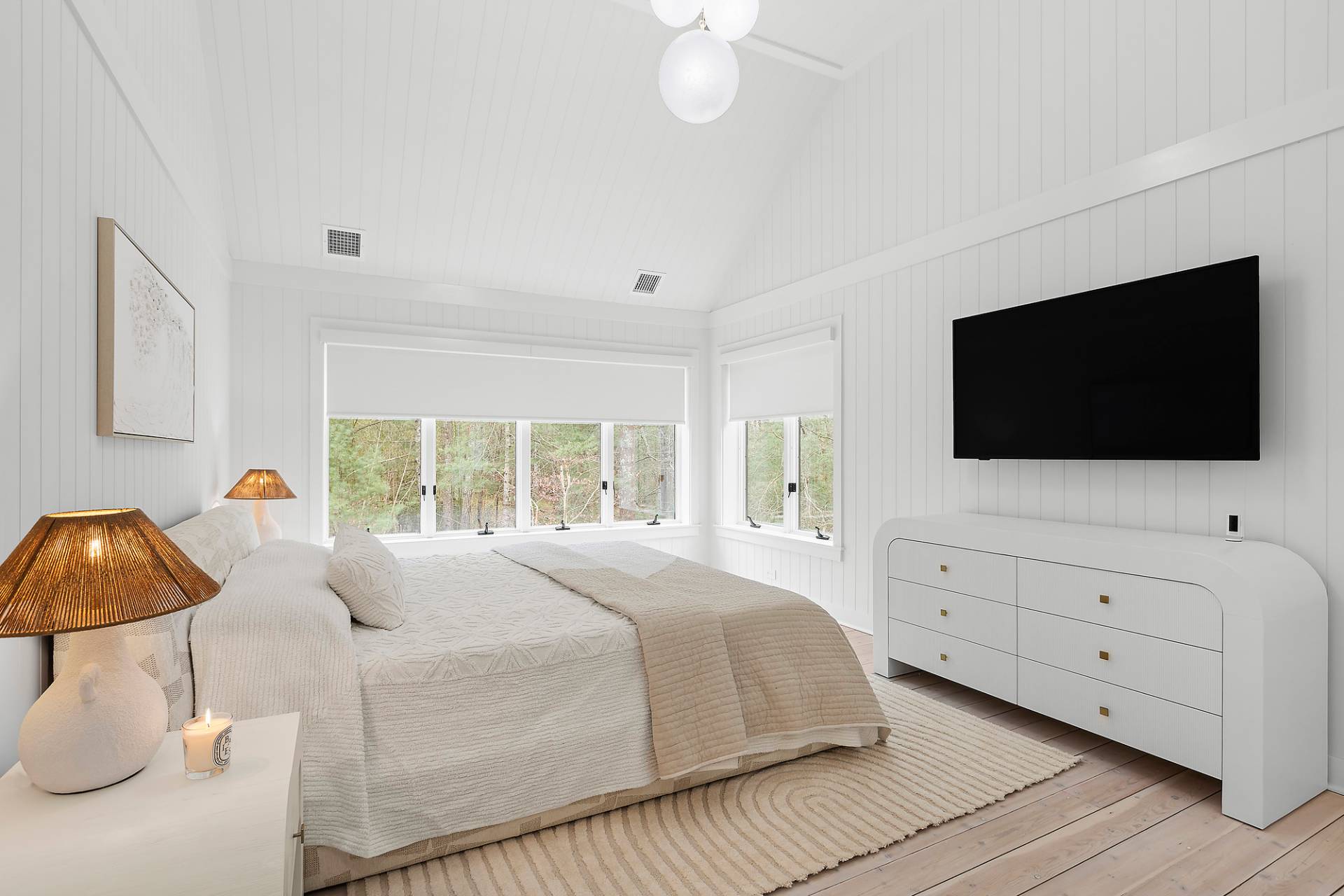 5 Phoebe Scoys Road East Hampton, NY 11937 - Photo 32 of 43 a bedroom with a bed and a flat screen tv