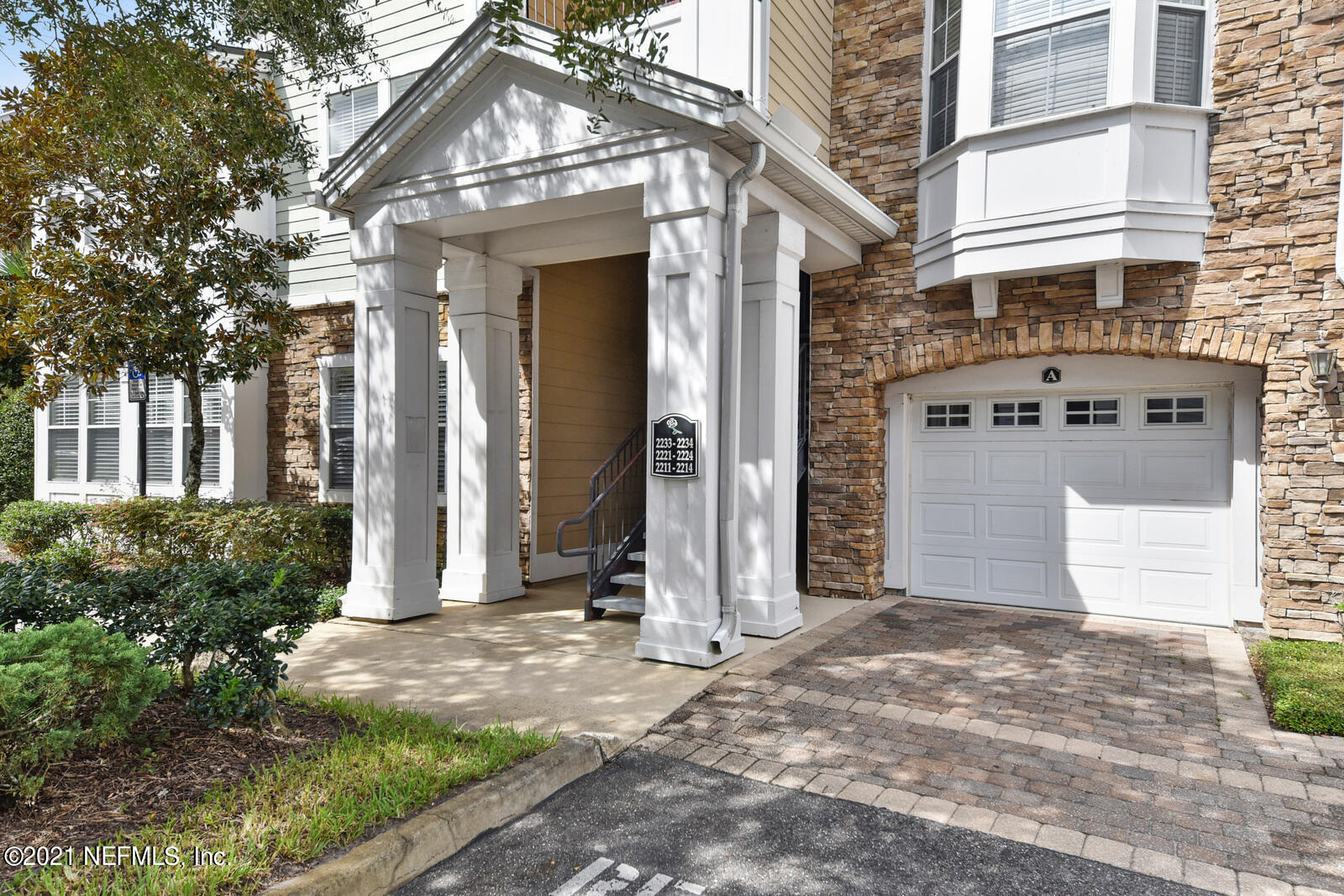 a view of a building with a tree