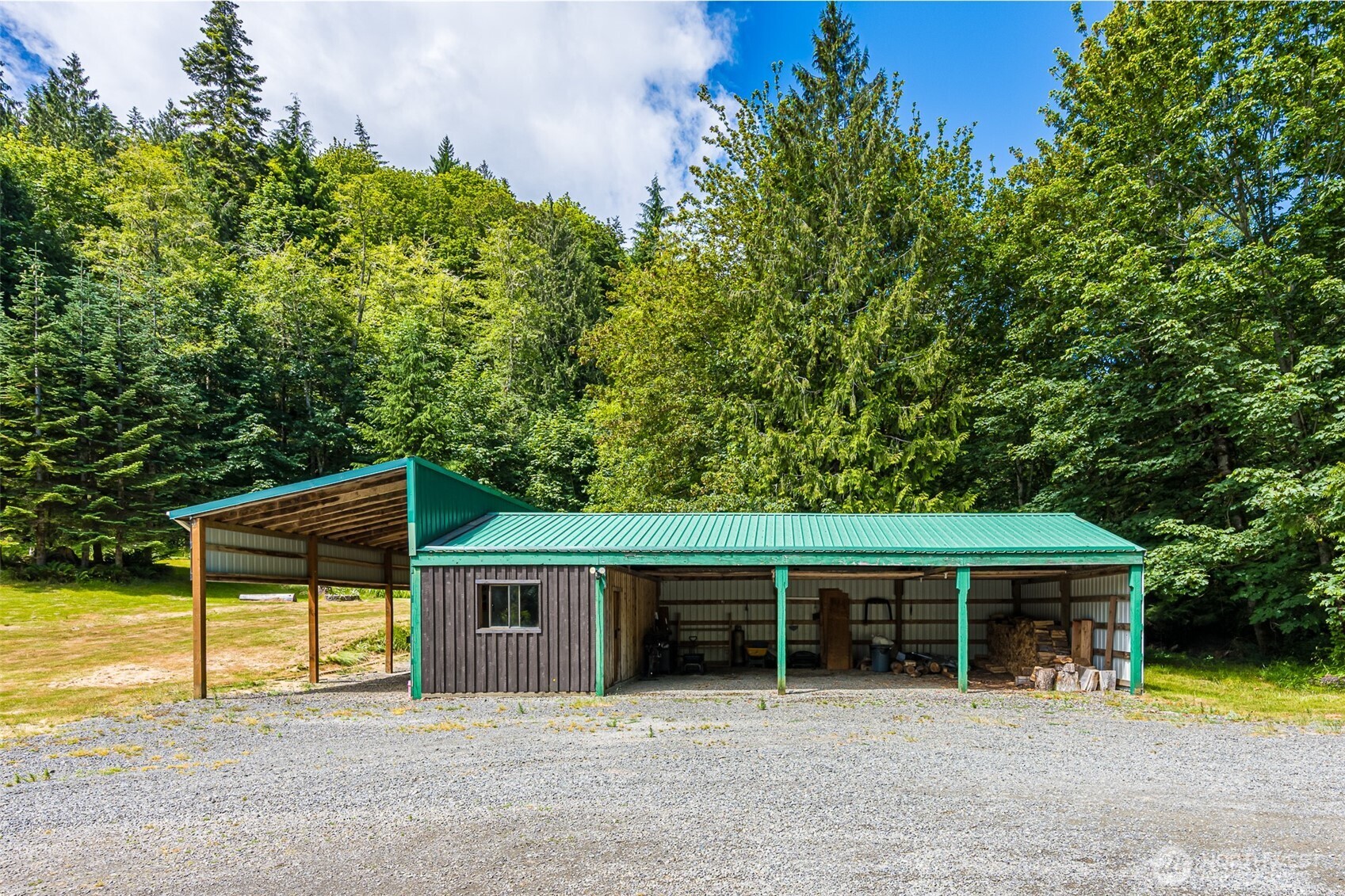 1422 Grauel-Ramapo Road Port Angeles, WA 98363 - Photo 32 of 40 a view of a house with a patio and a yard