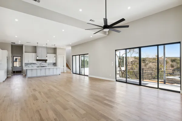 a view of a kitchen with a sink and a window