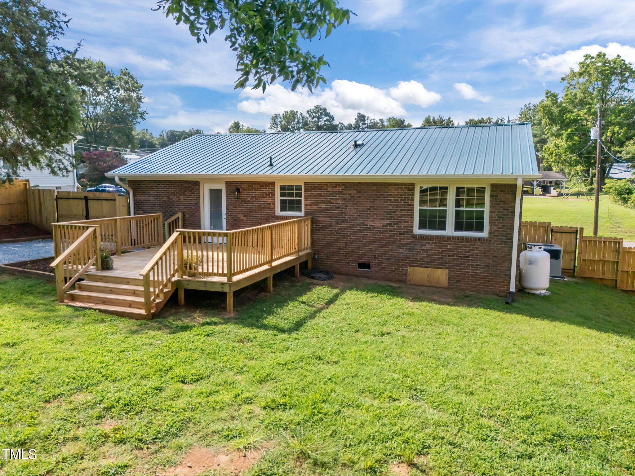 150 Summit Street Roxboro, NC 27573 - Photo 2 of 37 a view of a house with a yard porch and wooden fence