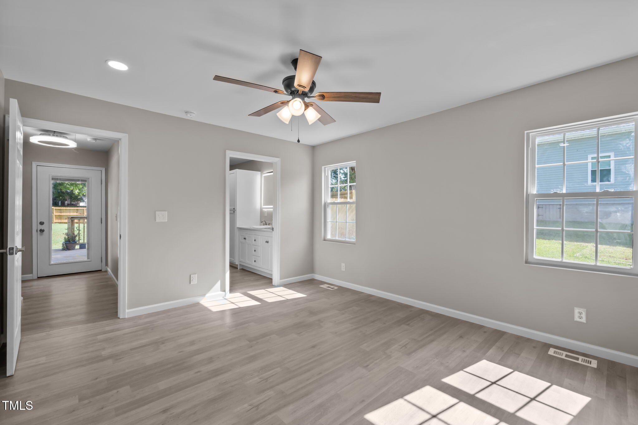 150 Summit Street Roxboro, NC 27573 - Photo 23 of 37 wooden floor in an empty room with a window