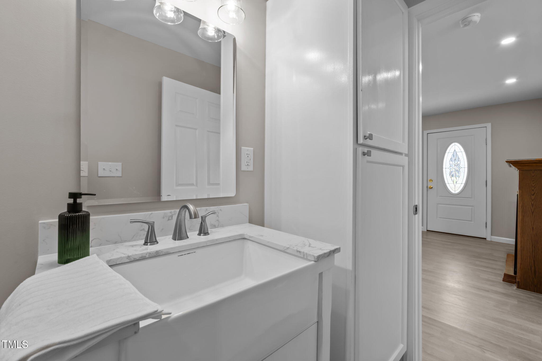 150 Summit Street Roxboro, NC 27573 - Photo 33 of 37 a bathroom with a sink and a mirror