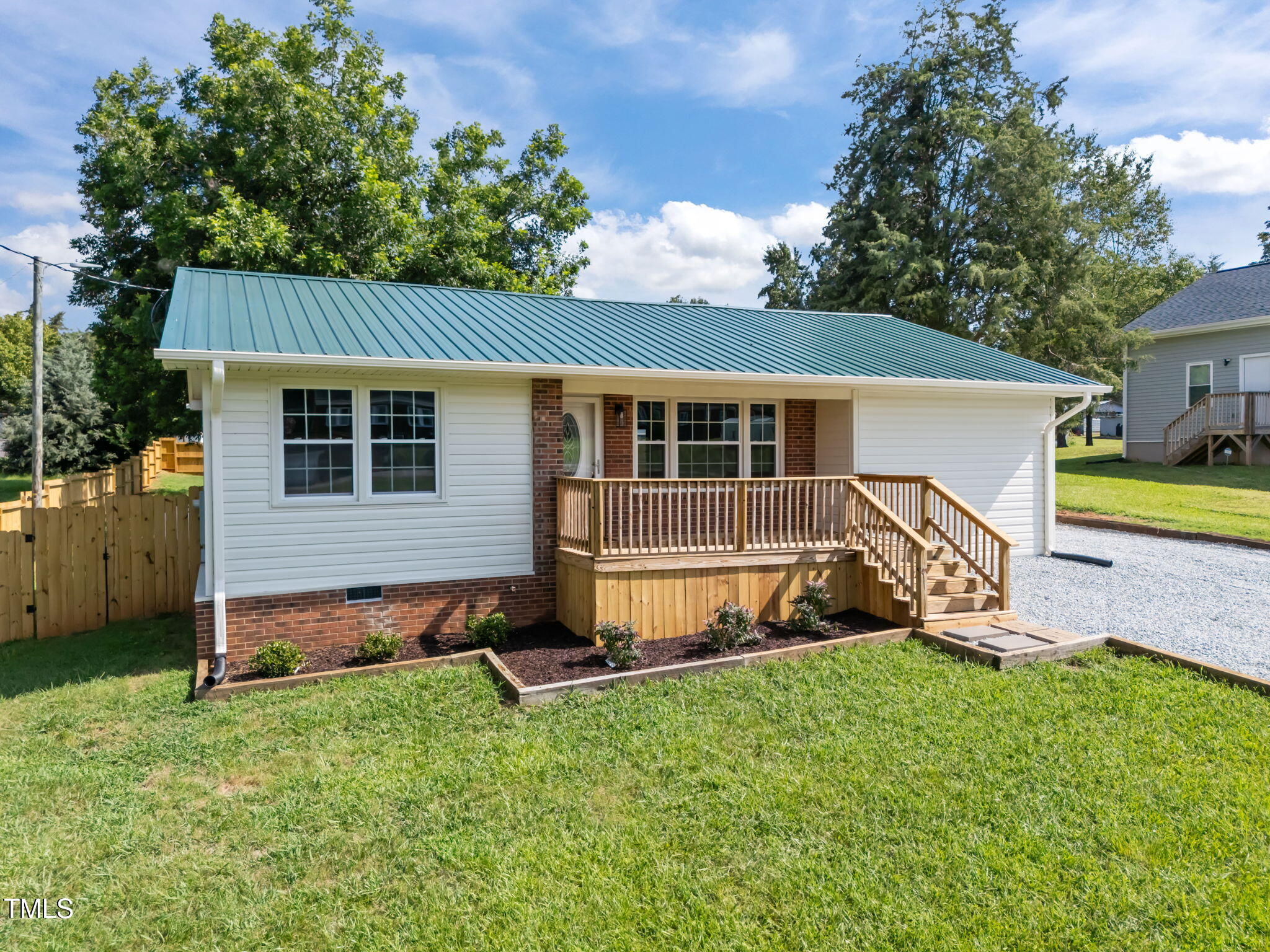 150 Summit Street Roxboro, NC 27573 - Photo 4 of 37 a view of a house with a yard and sitting area
