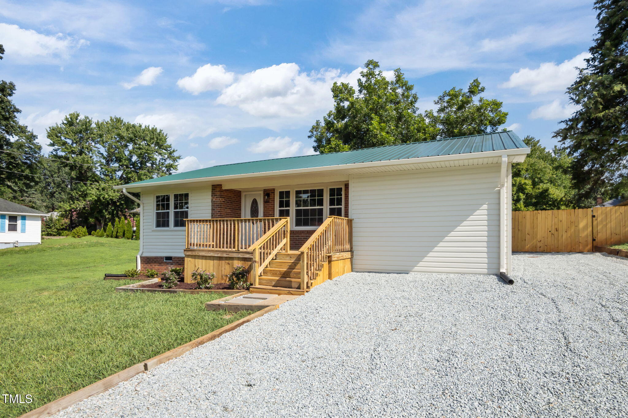 150 Summit Street Roxboro, NC 27573 - Photo 7 of 37 a view of a house with backyard and a garden