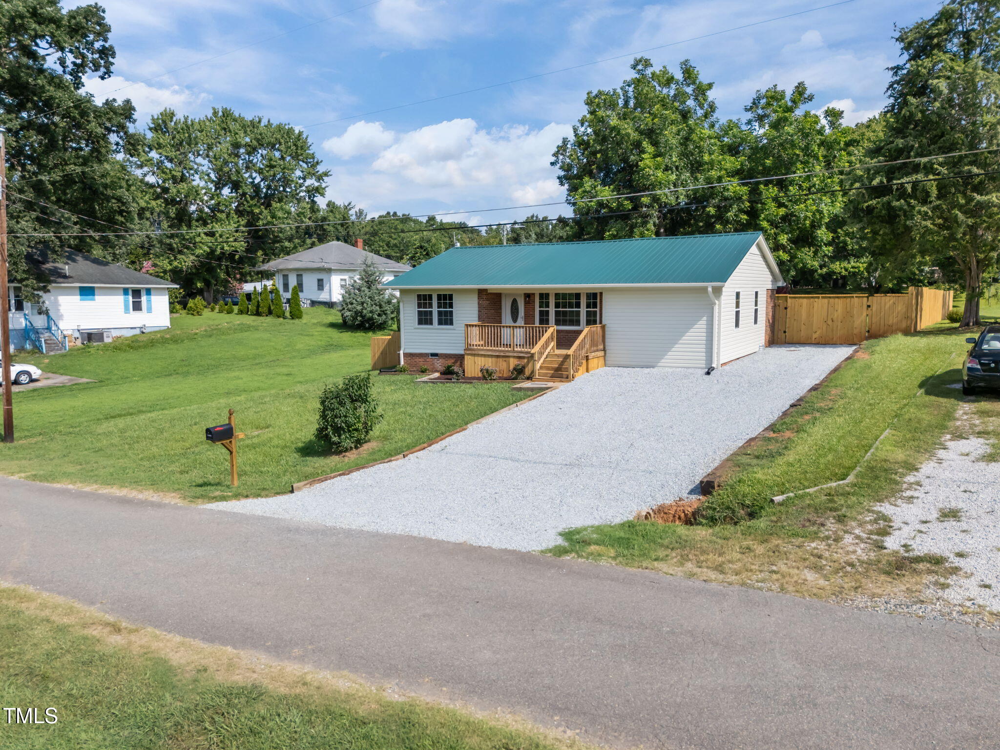 150 Summit Street Roxboro, NC 27573 - Photo 10 of 37 a front view of a house with a yard and garage