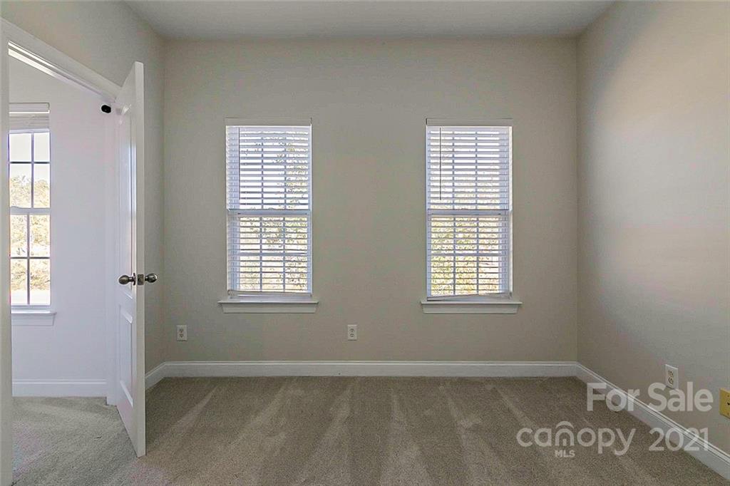 10426 Tom Short Road Charlotte, NC 28277 - Photo 11 of 17 a view of an empty room with a window