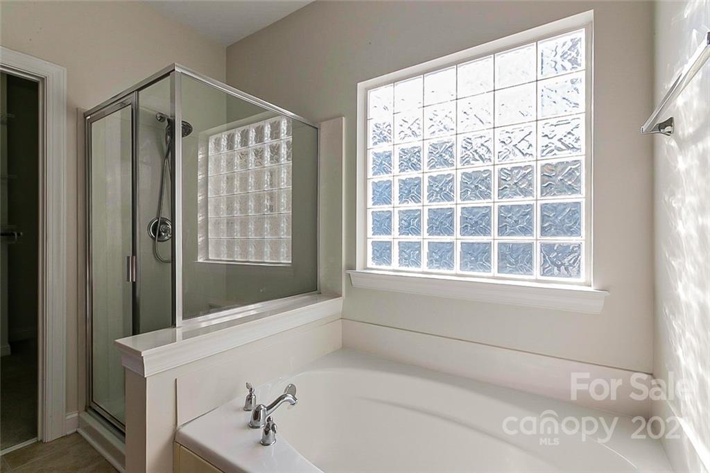 10426 Tom Short Road Charlotte, NC 28277 - Photo 13 of 17 a bathroom with a shower and a sink