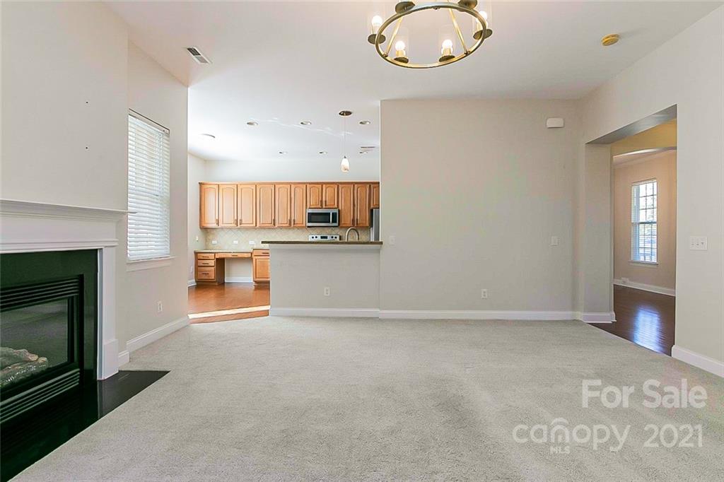 10426 Tom Short Road Charlotte, NC 28277 - Photo 4 of 17 a view of a kitchen with a sink and a fireplace