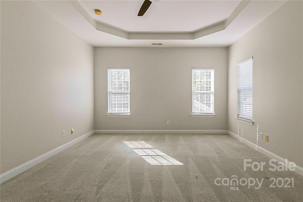 10426 Tom Short Road Charlotte, NC 28277 - Photo 8 of 17 an empty room with windows