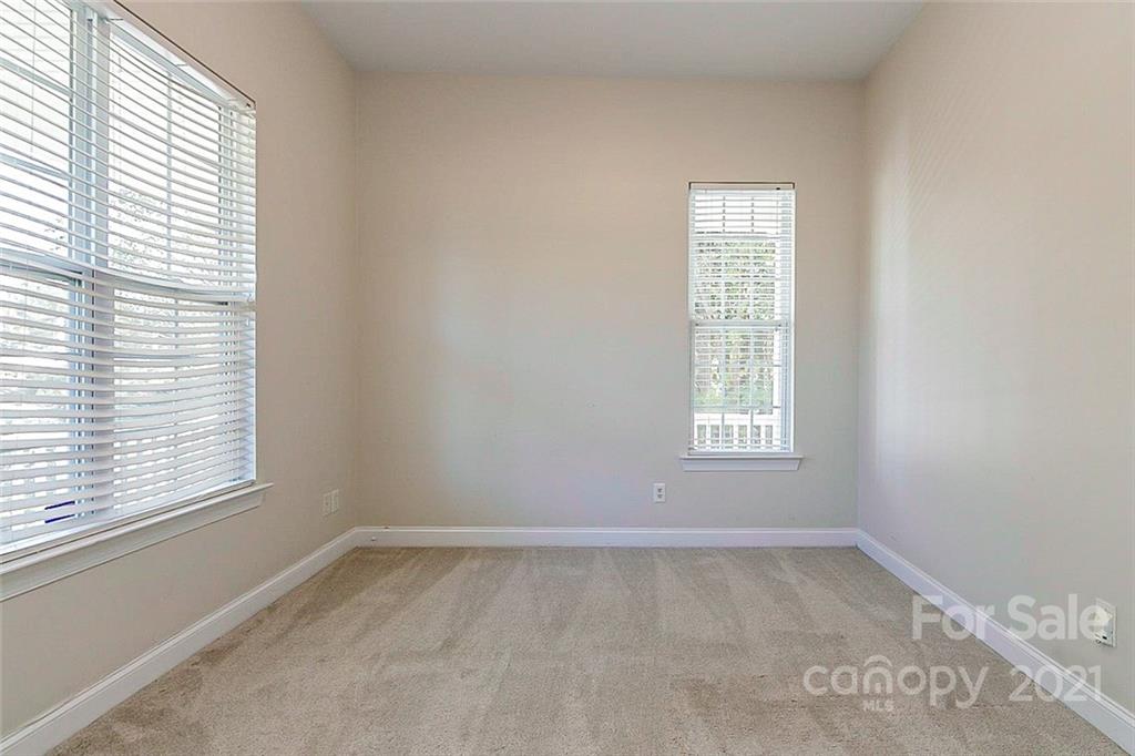 10426 Tom Short Road Charlotte, NC 28277 - Photo 9 of 17 an empty room with a window