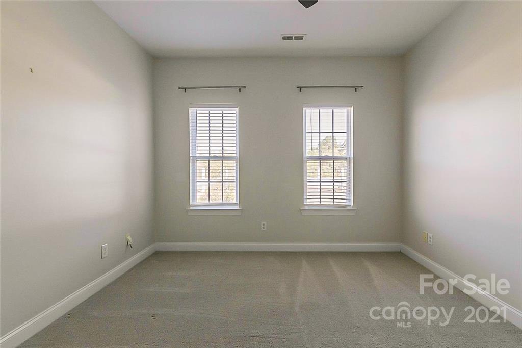 10426 Tom Short Road Charlotte, NC 28277 - Photo 10 of 17 an empty room with a window