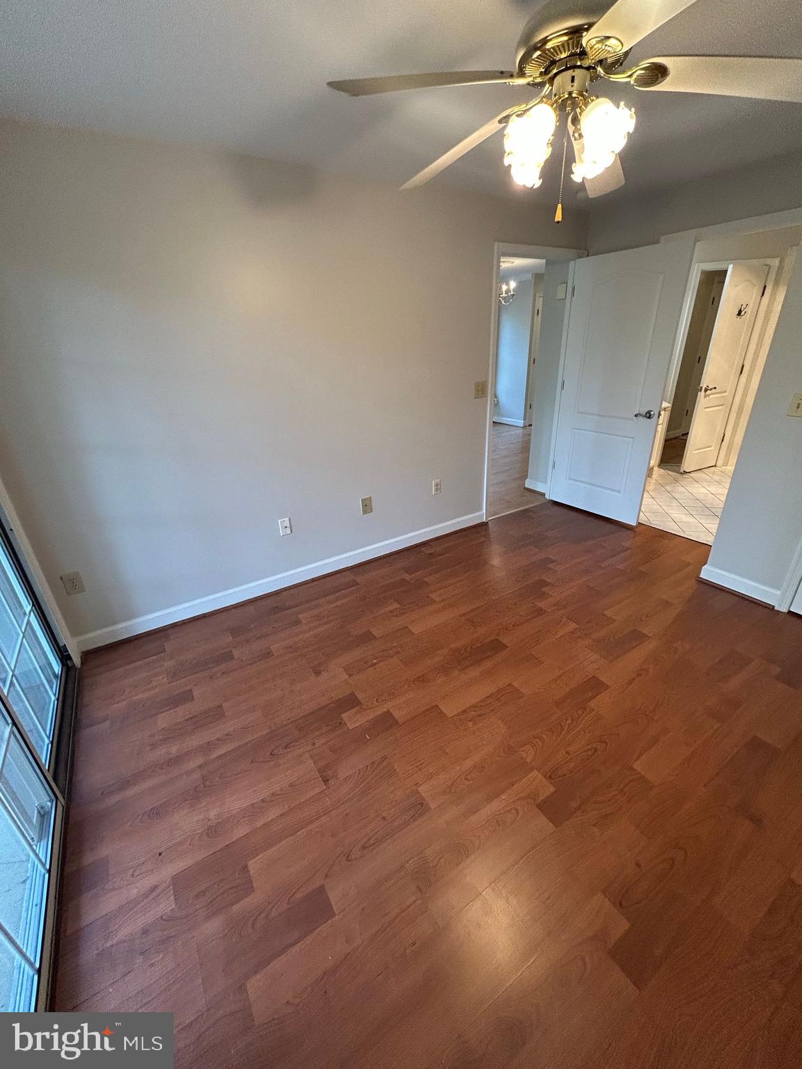 6924 Fairfax Drive, Unit 140 Arlington, VA 22213 - Photo 16 of 19 a view of an empty room with a chandelier fan