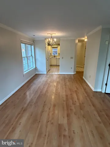 a view of an empty room and a window