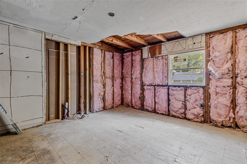 902 North Frances Street Terrell, TX 75160 - Photo 18 of 28 a view of a garage with wooden walls