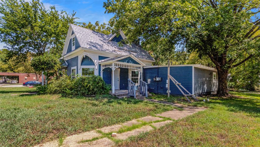 902 North Frances Street Terrell, TX 75160 - Photo 2 of 28 a view of a house with a yard and trees