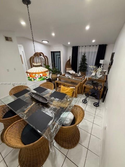 2429 Southwest 110th Avenue Miami, FL 33165 - Photo 9 of 15 a room with gym equipment and a chandelier