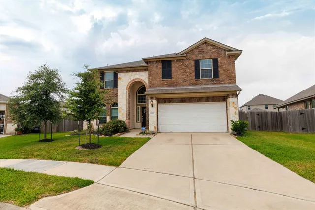 a front view of a house with yard