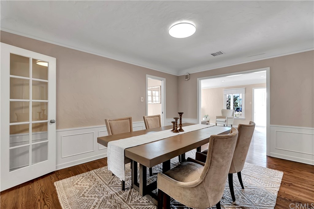 111 West Lemon Avenue Arcadia, CA 91007 - Photo 12 of 46 a view of a dining room with furniture and wooden floor