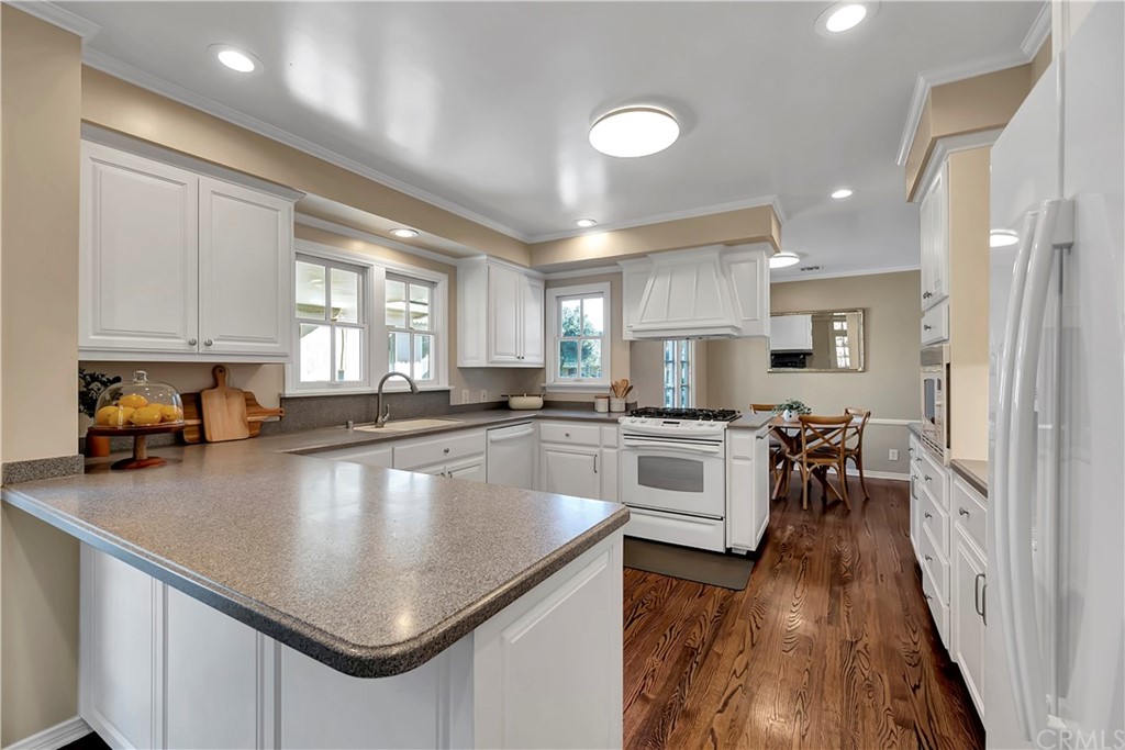 111 West Lemon Avenue Arcadia, CA 91007 - Photo 17 of 46 a kitchen with a stove a sink and a refrigerator
