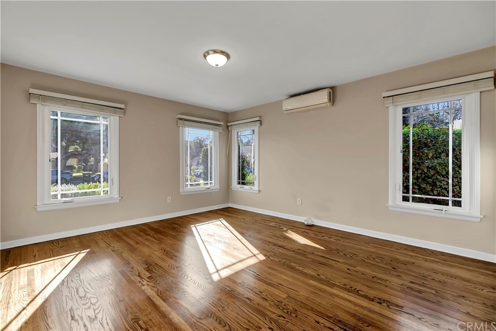 111 West Lemon Avenue Arcadia, CA 91007 - Photo 21 of 46 a view of an empty room with wooden floor and a window