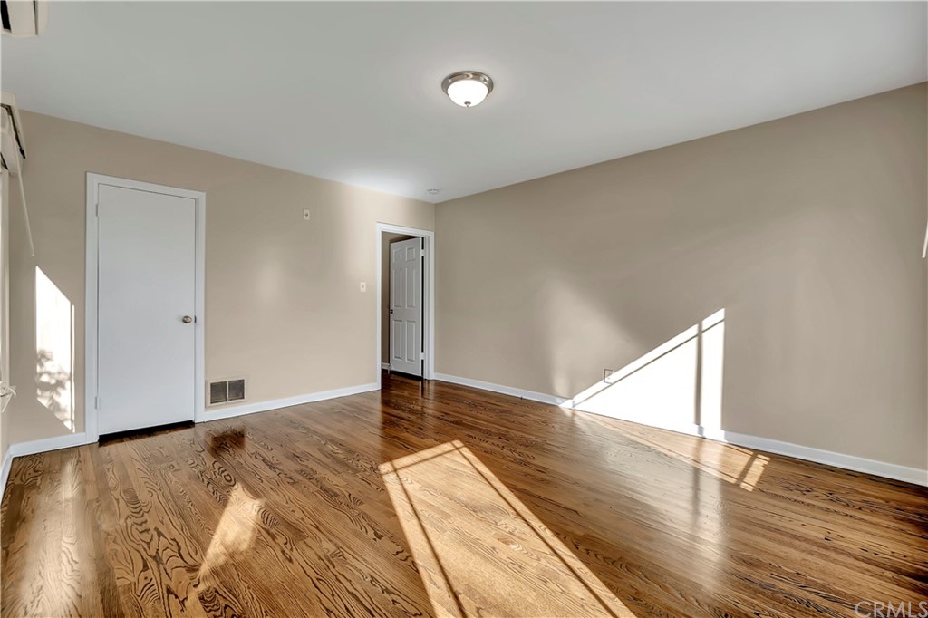 111 West Lemon Avenue Arcadia, CA 91007 - Photo 22 of 46 a view of an empty room with wooden floor