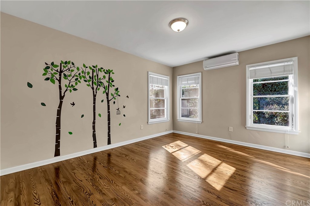 111 West Lemon Avenue Arcadia, CA 91007 - Photo 23 of 46 a view of an empty room with a window and wooden floor