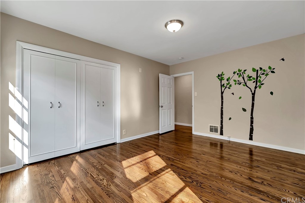 111 West Lemon Avenue Arcadia, CA 91007 - Photo 24 of 46 a view of an empty room with wooden floor and a window