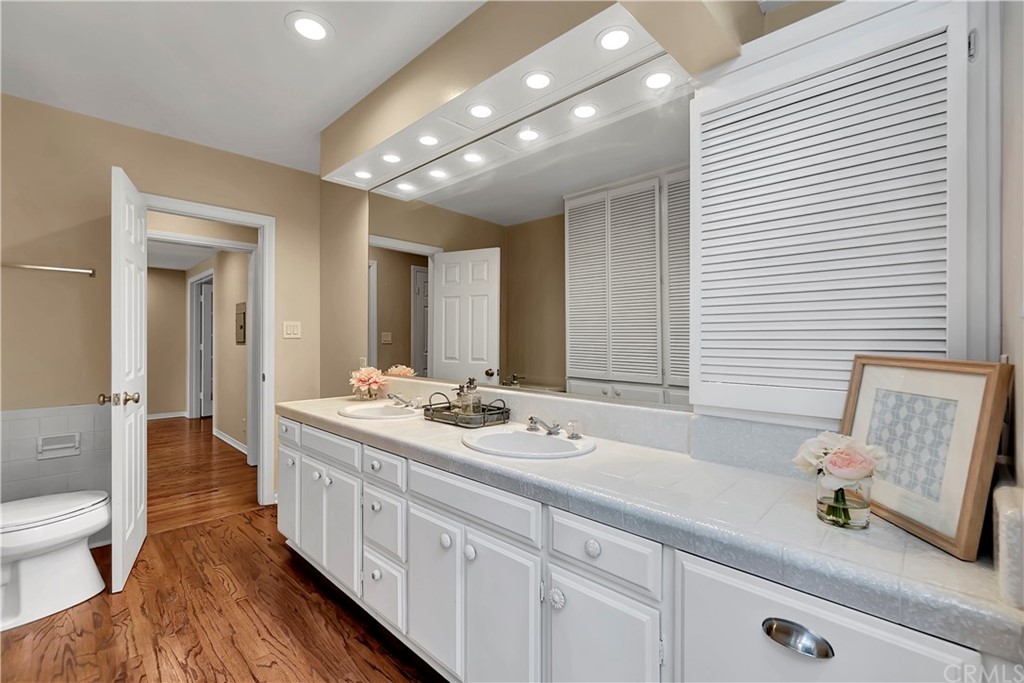 111 West Lemon Avenue Arcadia, CA 91007 - Photo 27 of 46 a spacious bathroom with double vanity and mirrors