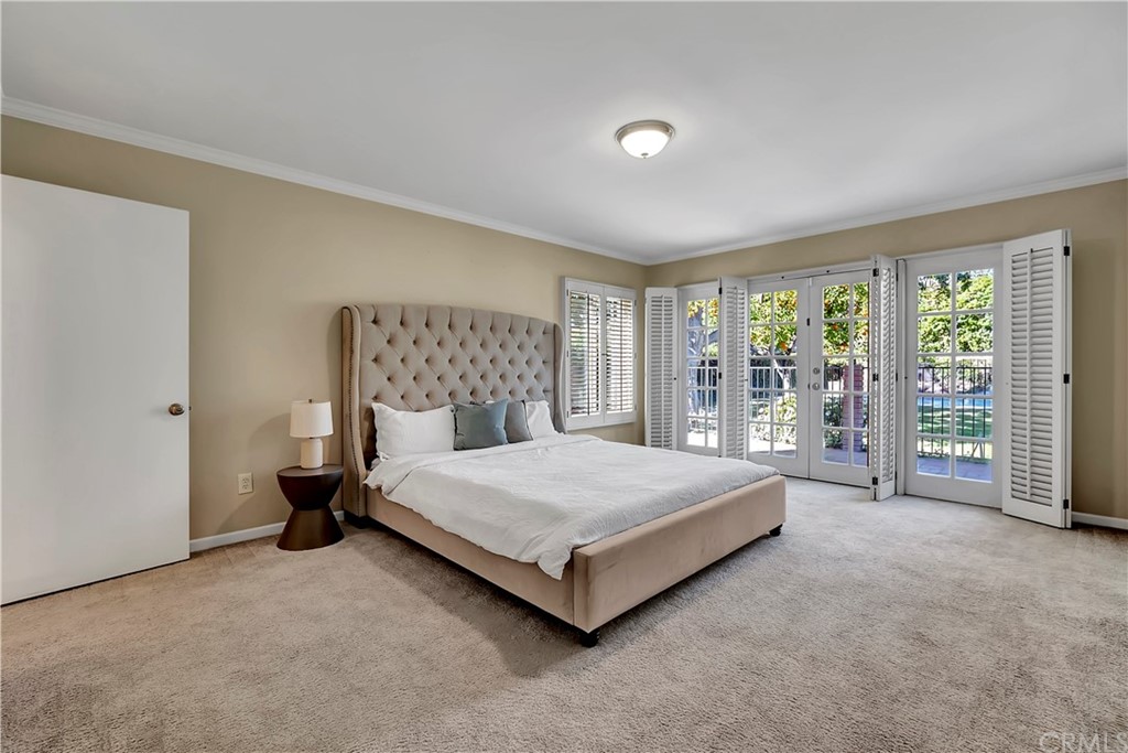111 West Lemon Avenue Arcadia, CA 91007 - Photo 28 of 46 a spacious bedroom with a large bed and a large window