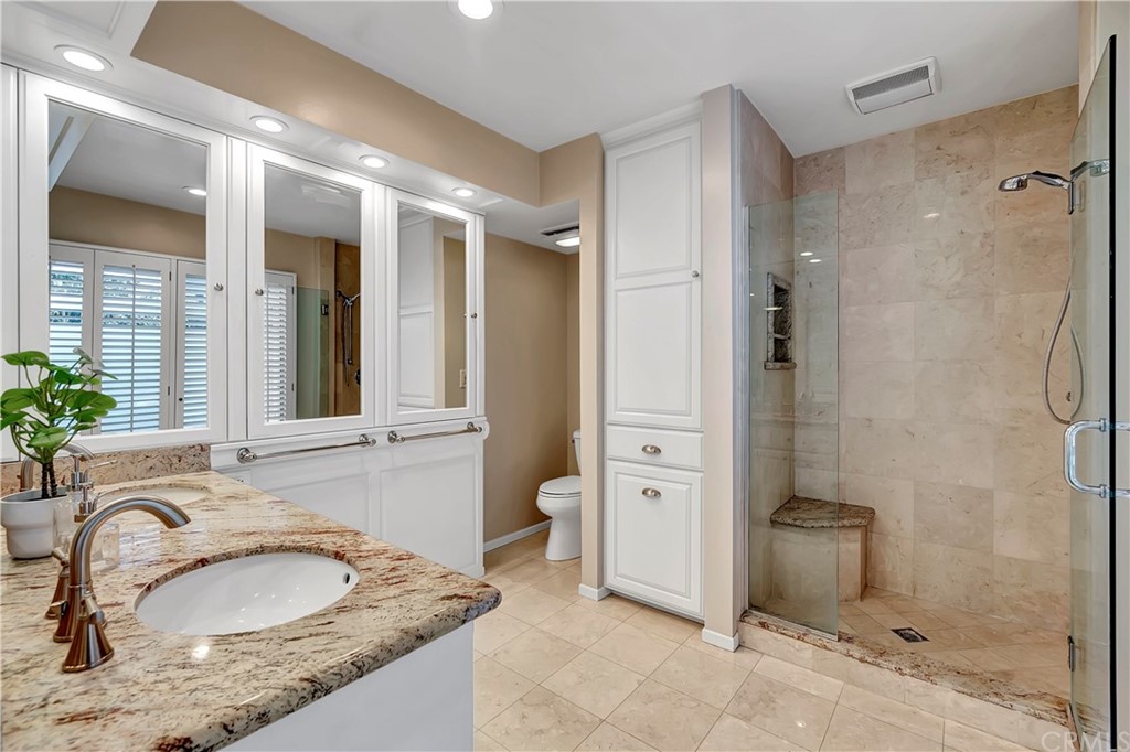 111 West Lemon Avenue Arcadia, CA 91007 - Photo 30 of 46 a bathroom with a granite countertop sink and a mirror