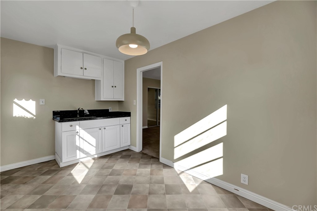 111 West Lemon Avenue Arcadia, CA 91007 - Photo 44 of 46 a kitchen with a refrigerator and white cabinets