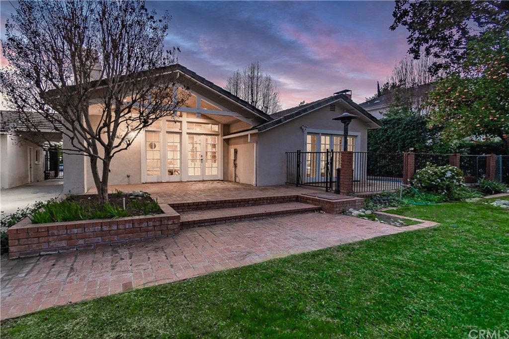 111 West Lemon Avenue Arcadia, CA 91007 - Photo 5 of 46 a front view of a house with a garden and yard