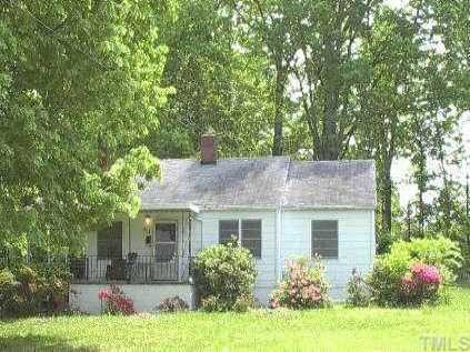 414 North King Charles Road Raleigh, NC 27610 - Photo 1 of 1 a front view of house with yard and trees in the background