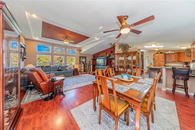 a living room with furniture a rug and a chandelier
