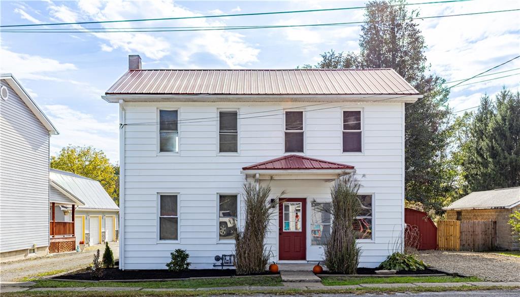 a aerial view of a house with a yard