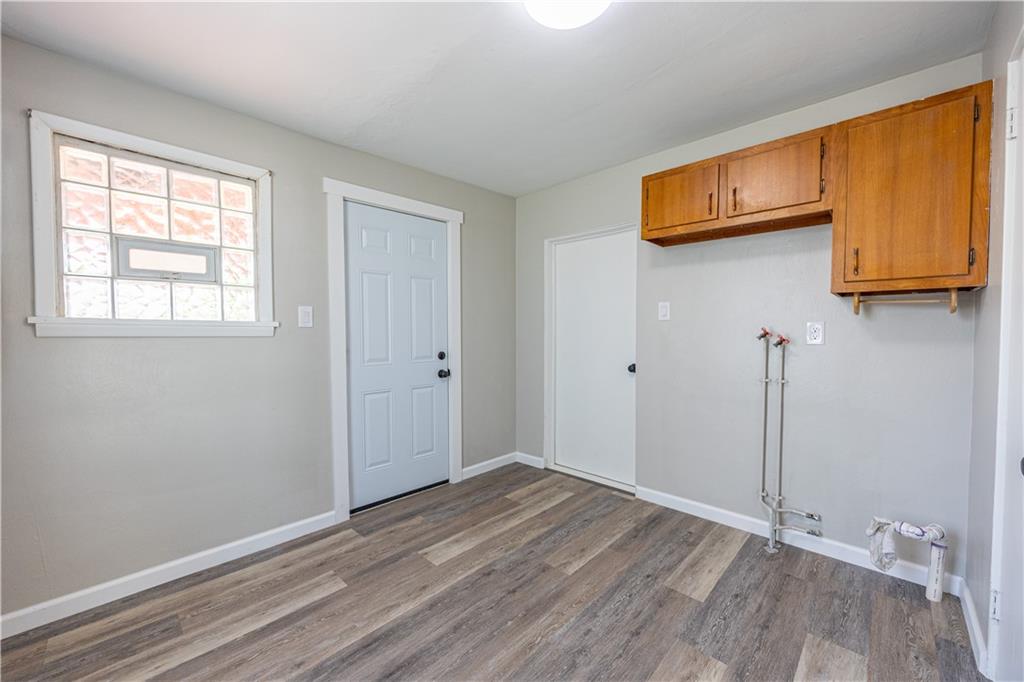 489 Indiana Road Creekside, PA 15732 - Photo 17 of 22 a view of an empty room with wooden floor and a window