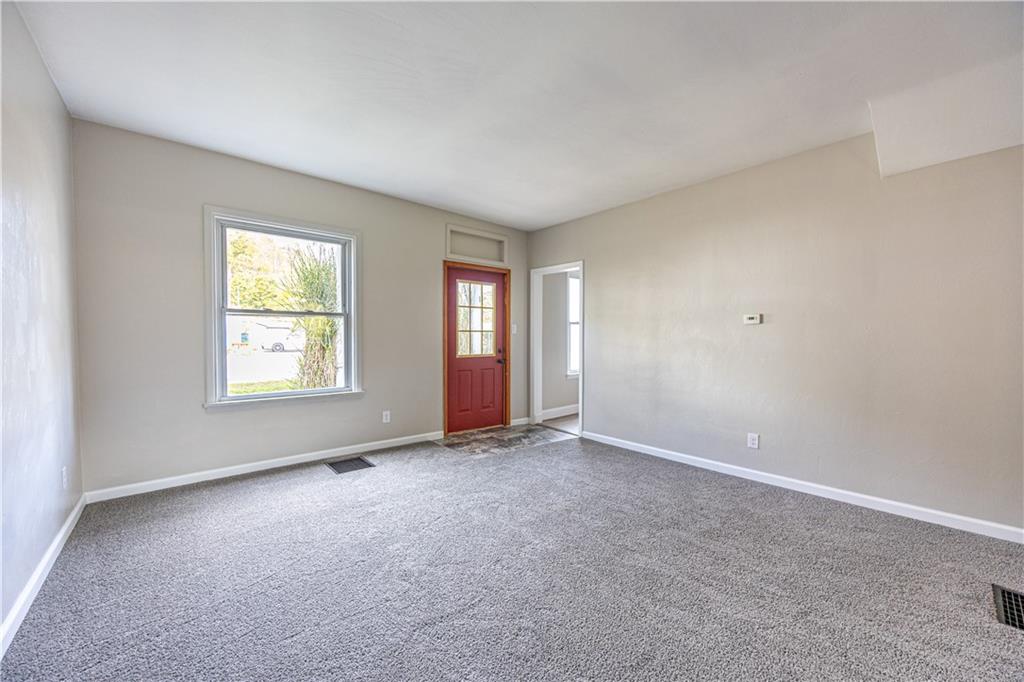 489 Indiana Road Creekside, PA 15732 - Photo 4 of 22 an empty room with windows