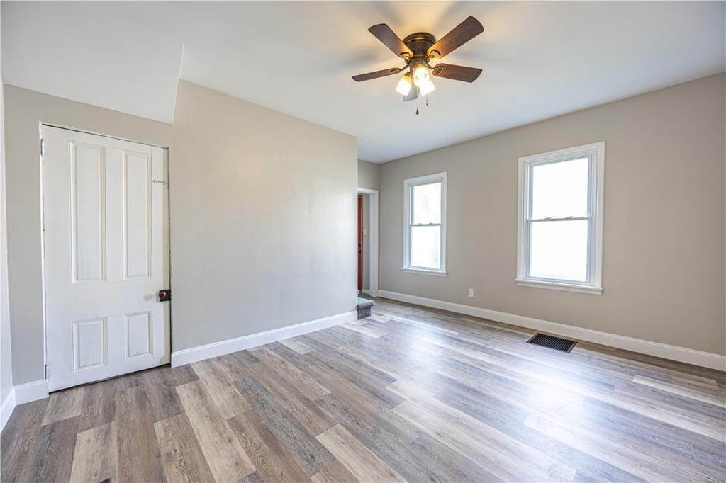 489 Indiana Road Creekside, PA 15732 - Photo 9 of 22 an empty room with wooden floor and windows