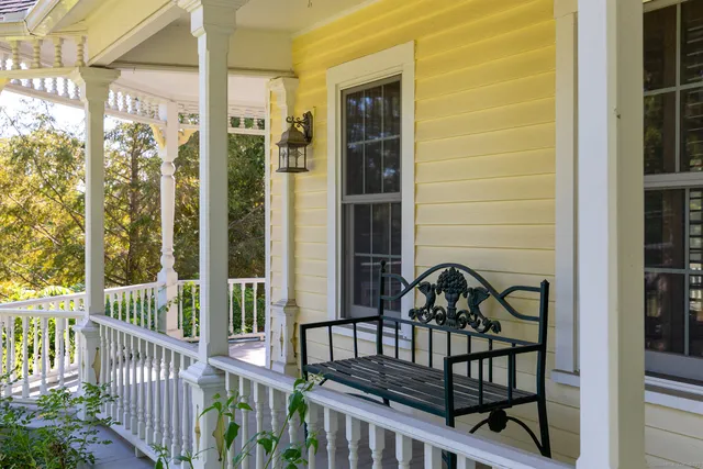 a view of a balcony with wooden floor