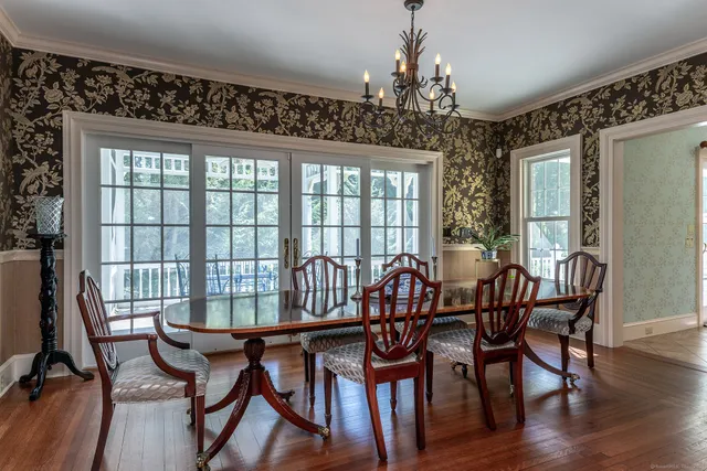 a view of a dining room with furniture window and wooden floor
