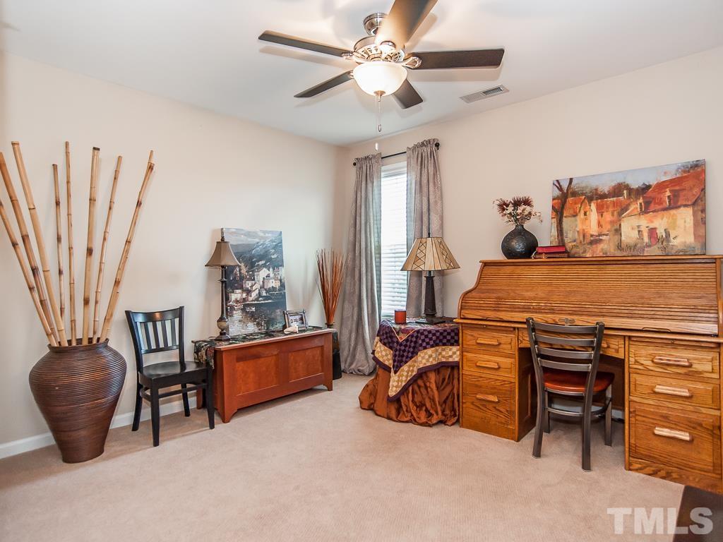 1311 Still Monument Way Raleigh, NC 27603 - Photo 24 of 33 a bedroom with furniture and a rug