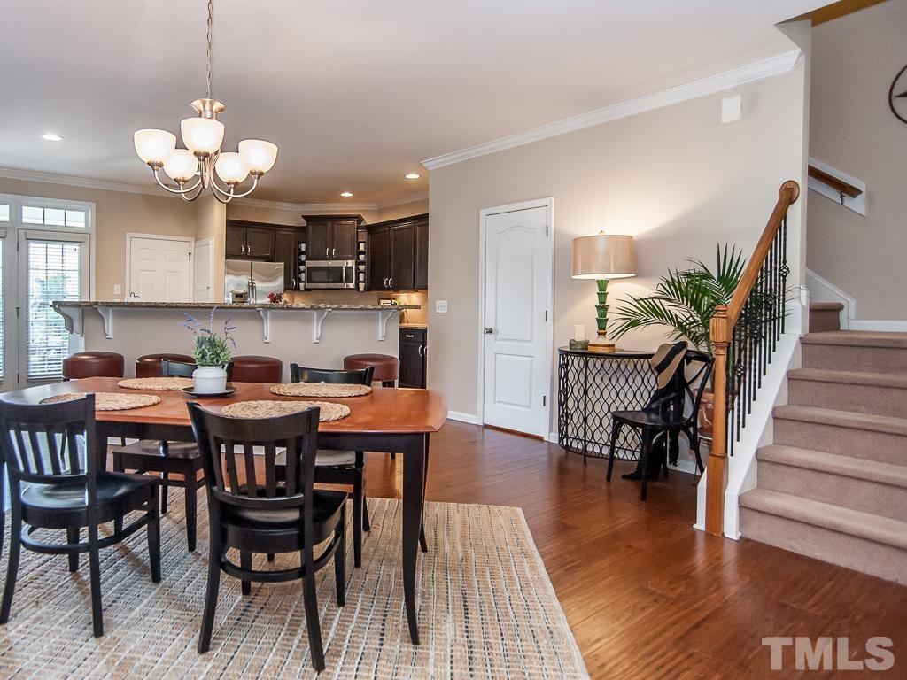 1311 Still Monument Way Raleigh, NC 27603 - Photo 6 of 33 a view of a dining room with furniture and wooden floor