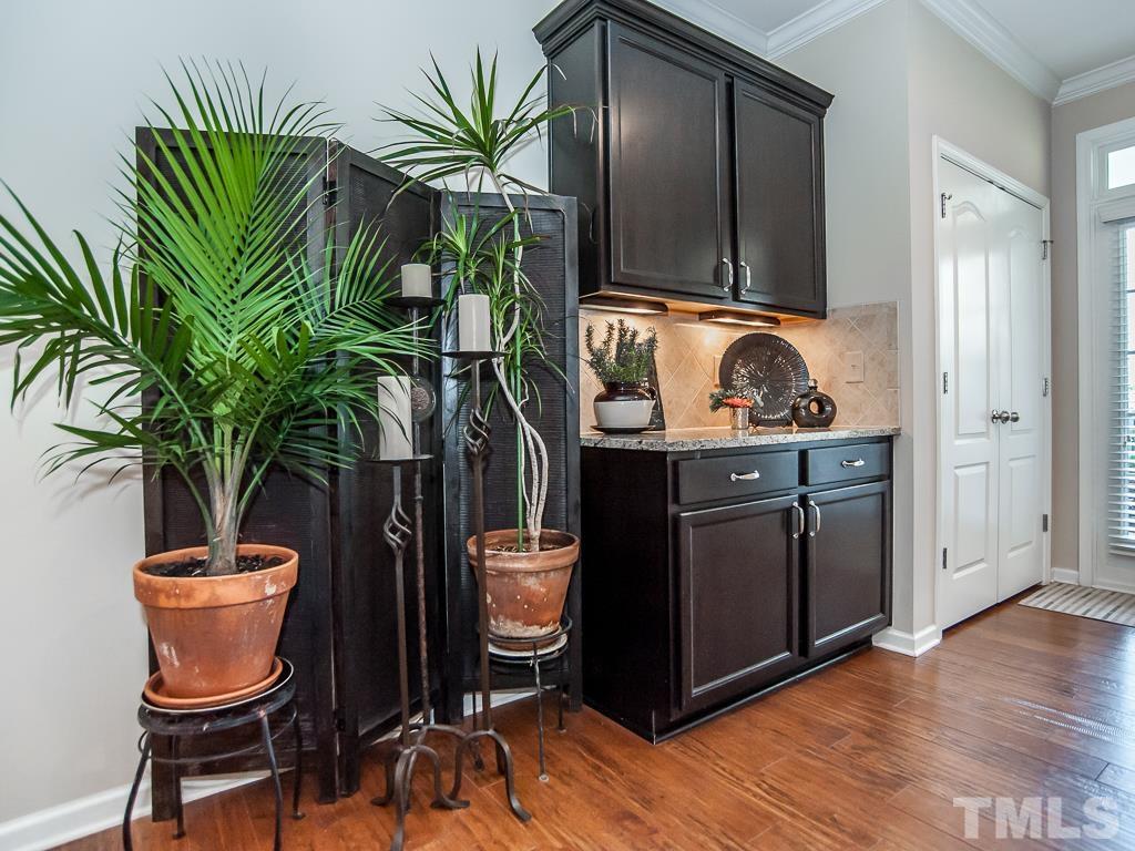 1311 Still Monument Way Raleigh, NC 27603 - Photo 10 of 33 a room with furniture and a potted plant
