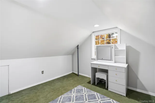 a view of a kitchen with cabinets and fireplace