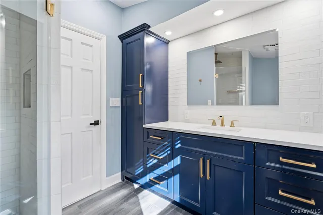 a bathroom with a sink and a mirror