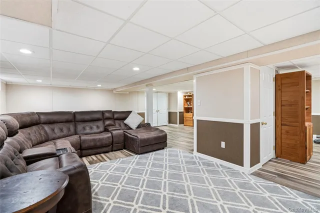 a living room with furniture and a rug