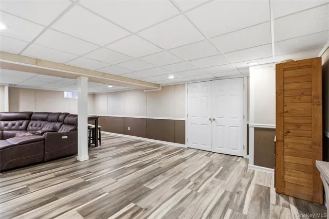 a spacious bedroom with a bed and a dresser